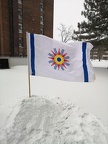 Chaldean flag in front of building